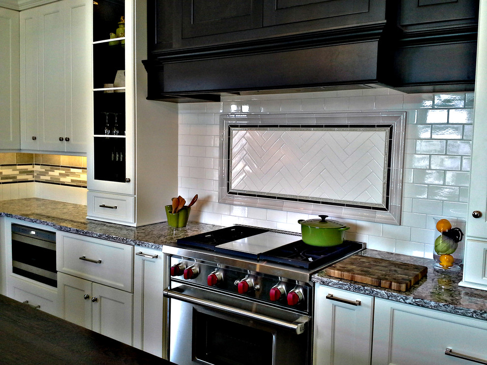 Mediterranean kitchen in Chicago with engineered stone countertops, white splashback and ceramic splashback.