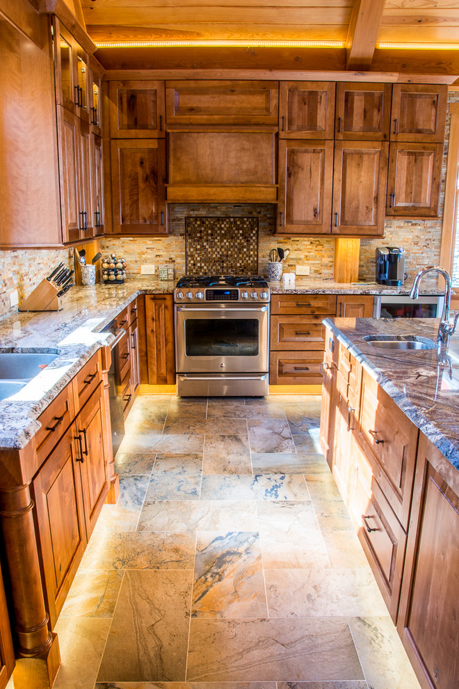 Inspiration for a large traditional u-shaped open plan kitchen in Raleigh with a belfast sink, raised-panel cabinets, medium wood cabinets, granite worktops, multi-coloured splashback, porcelain splashback, stainless steel appliances, porcelain flooring and an island.