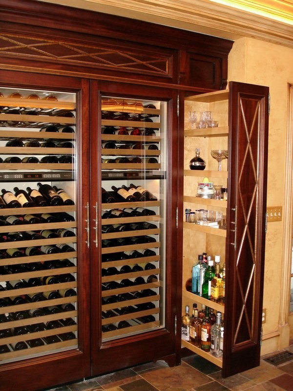 This is an example of a large classic wine cellar in Kansas City with slate flooring.