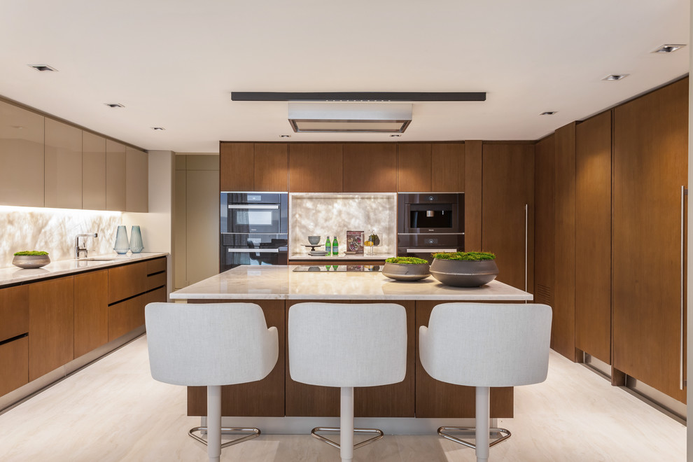 Inspiration for a large contemporary kitchen in Miami with a submerged sink, flat-panel cabinets, onyx worktops, ceramic flooring, an island, beige floors, beige worktops, dark wood cabinets and beige splashback.