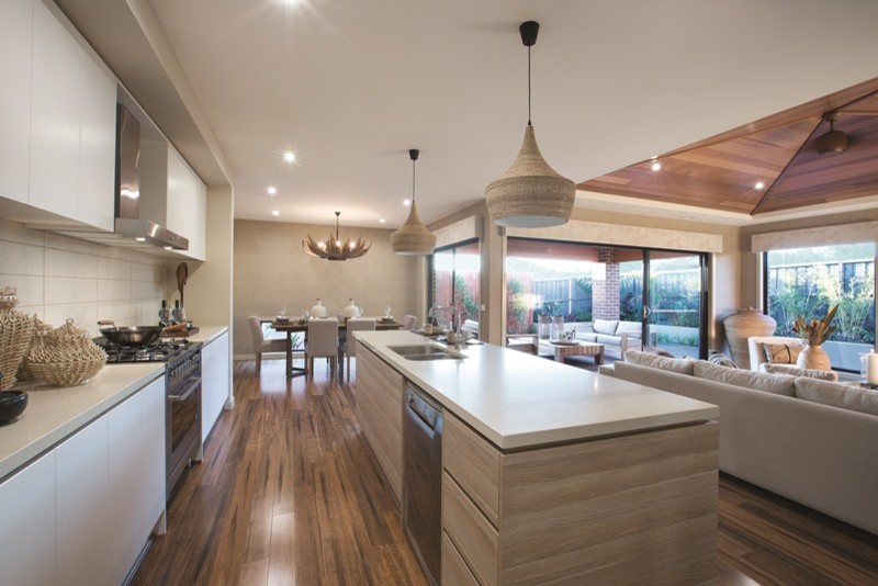 Example of an island style kitchen design in Melbourne