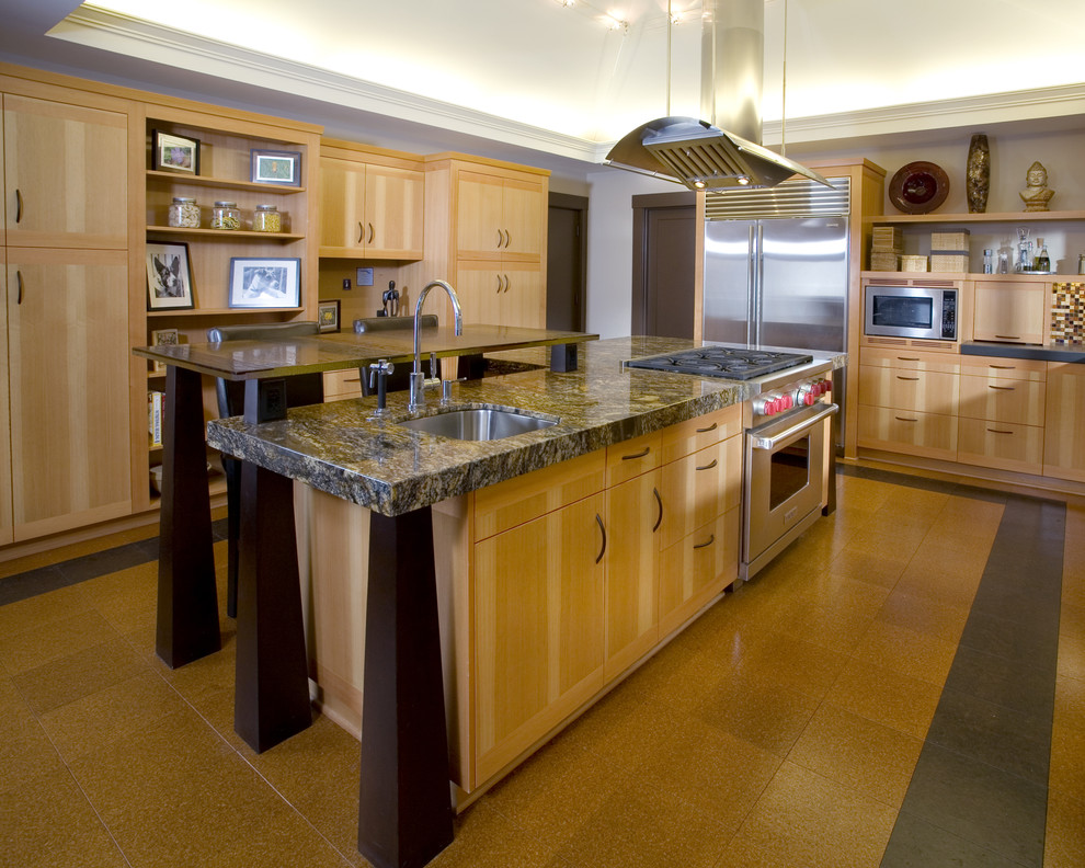 Example of a zen kitchen design in Portland with stainless steel appliances, granite countertops, flat-panel cabinets, light wood cabinets, brown backsplash, mosaic tile backsplash and a single-bowl sink