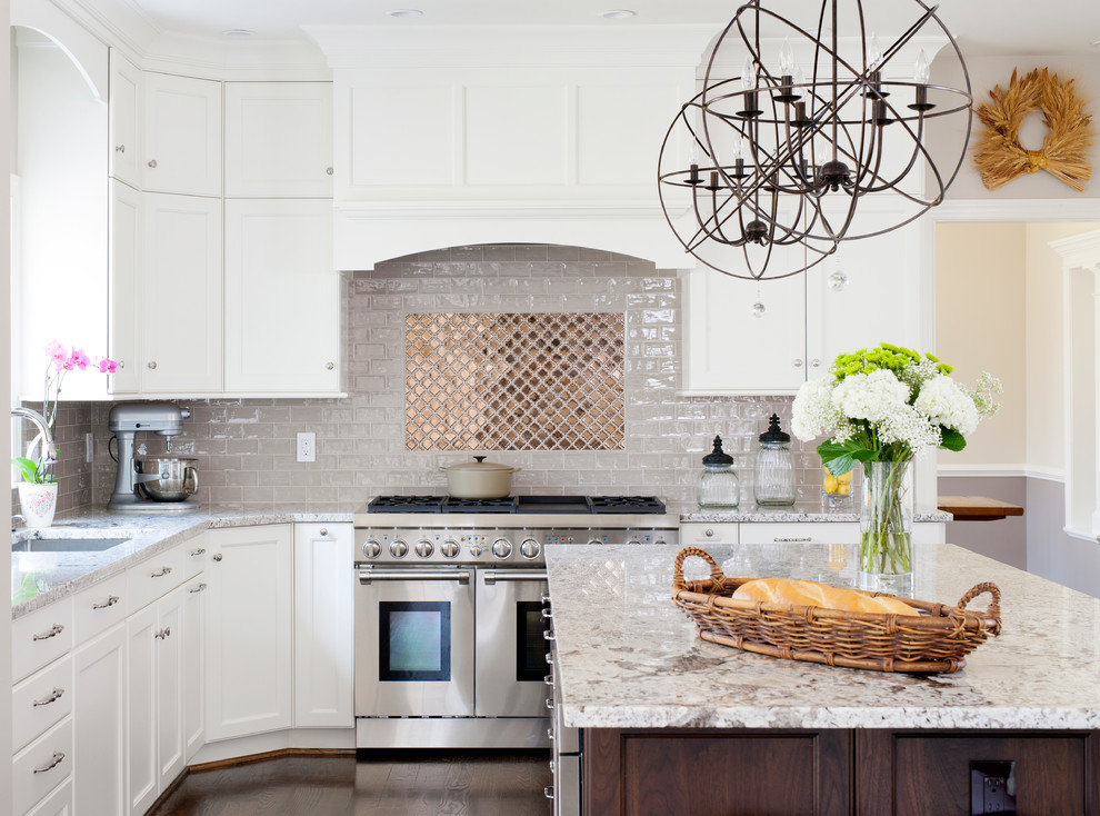 Inspiration for a large transitional u-shaped dark wood floor eat-in kitchen remodel in DC Metro with an undermount sink, shaker cabinets, white cabinets, granite countertops, beige backsplash, ceramic backsplash, stainless steel appliances and an island