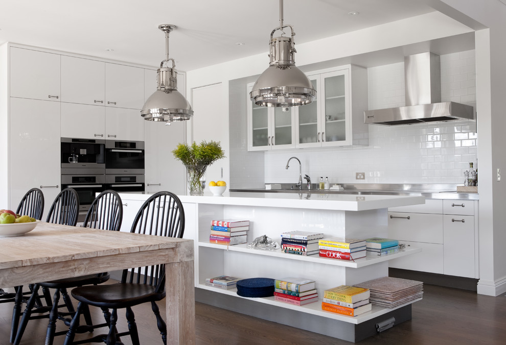 Inspiration for a timeless kitchen remodel in Melbourne with glass-front cabinets, white cabinets, white backsplash, subway tile backsplash and stainless steel appliances