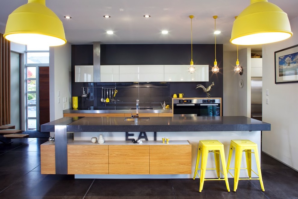 Eat-in kitchen - contemporary eat-in kitchen idea in Dunedin with an island