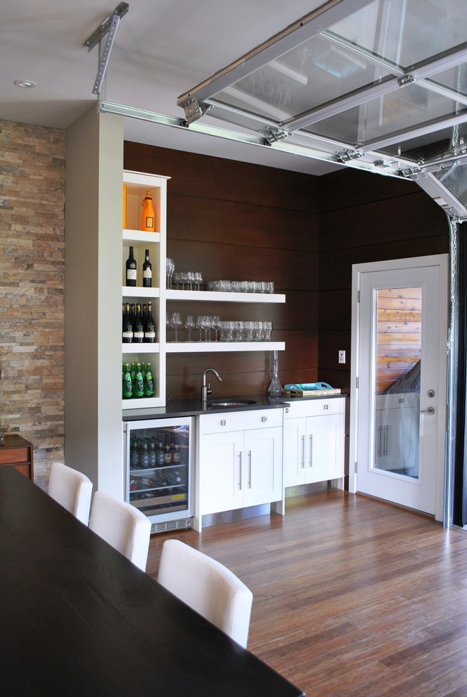 Inspiration for an industrial kitchen remodel in Ottawa with open cabinets and white cabinets