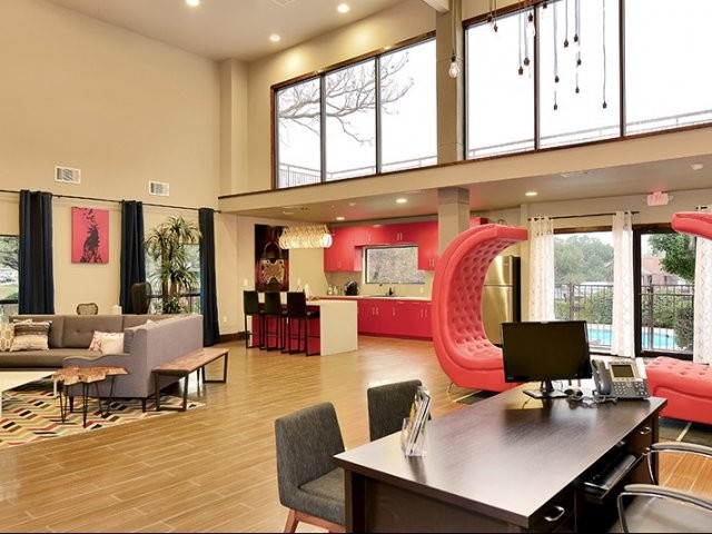 На фото: большая прямая кухня-гостиная в стиле модернизм с накладной мойкой, плоскими фасадами, красными фасадами, столешницей из бетона, техникой из нержавеющей стали, полом из керамогранита и островом