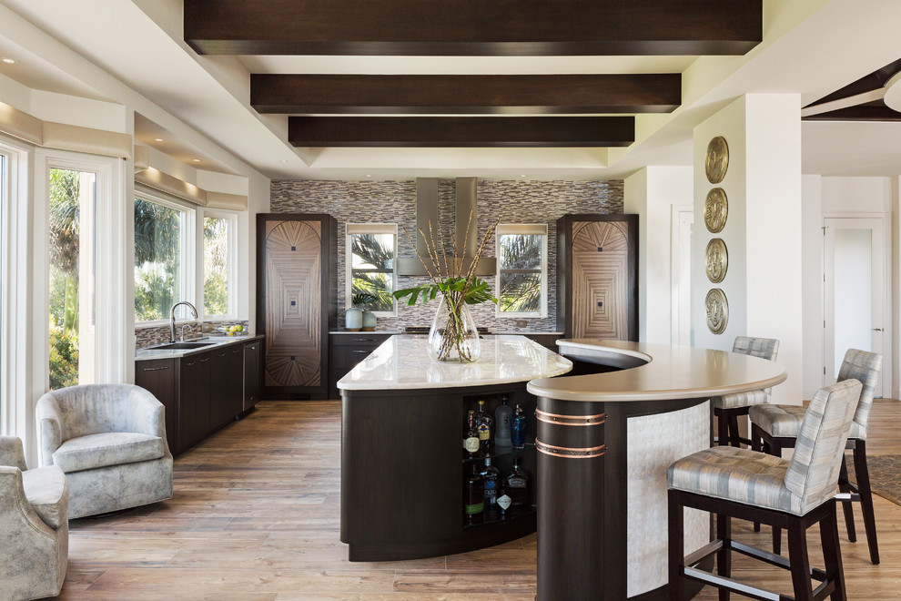 Design ideas for a large traditional kitchen in Miami with flat-panel cabinets, dark wood cabinets, onyx worktops, a single-bowl sink, multi-coloured splashback, mosaic tiled splashback, light hardwood flooring and multiple islands.