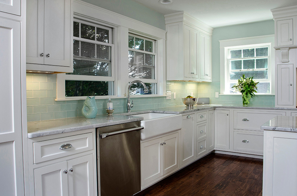 Contemporary l-shaped kitchen in Boston with shaker cabinets, white cabinets and an island.