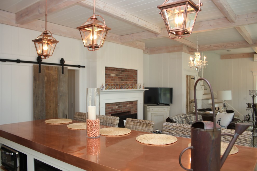 Eklektisk inredning av ett mellanstort kök, med en rustik diskho, vita skåp, bänkskiva i akrylsten och en köksö