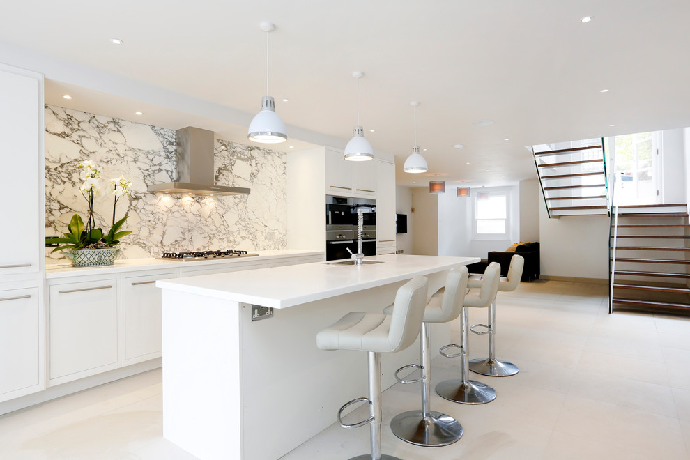 Inspiration for a contemporary galley kitchen in Surrey with flat-panel cabinets, white cabinets and white floors.