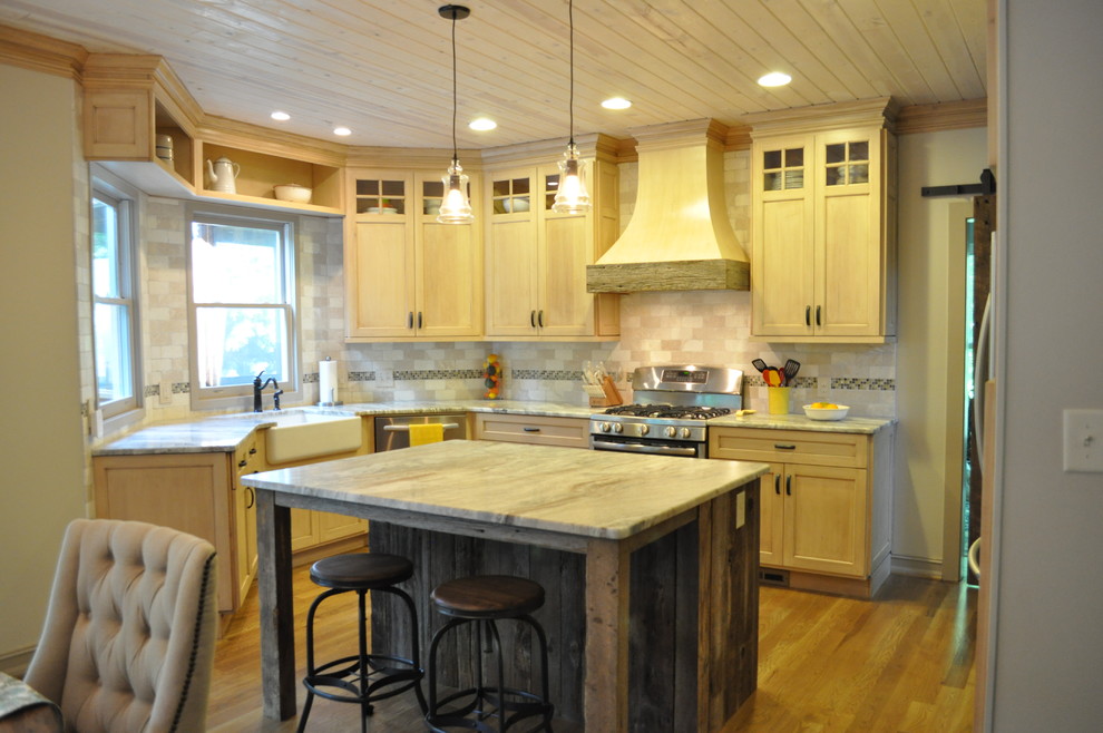 Inspiration for a mid-sized rustic u-shaped light wood floor open concept kitchen remodel in Atlanta with a farmhouse sink, distressed cabinets, quartzite countertops, beige backsplash, subway tile backsplash, stainless steel appliances, an island and recessed-panel cabinets