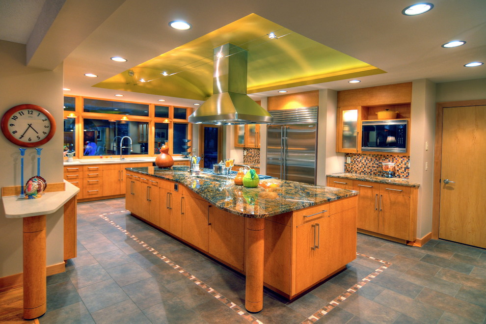 Enclosed kitchen - mid-sized modern slate floor and gray floor enclosed kitchen idea in Seattle with an undermount sink, flat-panel cabinets, light wood cabinets, granite countertops, multicolored backsplash, mosaic tile backsplash, stainless steel appliances and an island