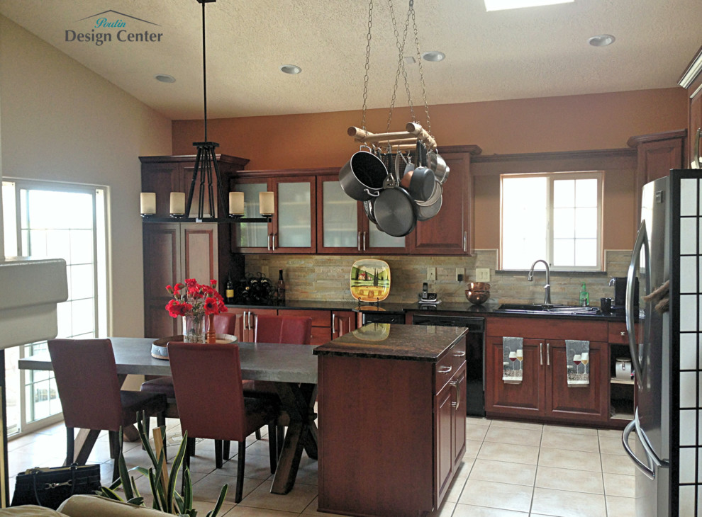 This is an example of a large classic l-shaped kitchen/diner in Albuquerque with a built-in sink, recessed-panel cabinets, dark wood cabinets, granite worktops, grey splashback, stone slab splashback, stainless steel appliances, porcelain flooring, an island, beige floors and black worktops.