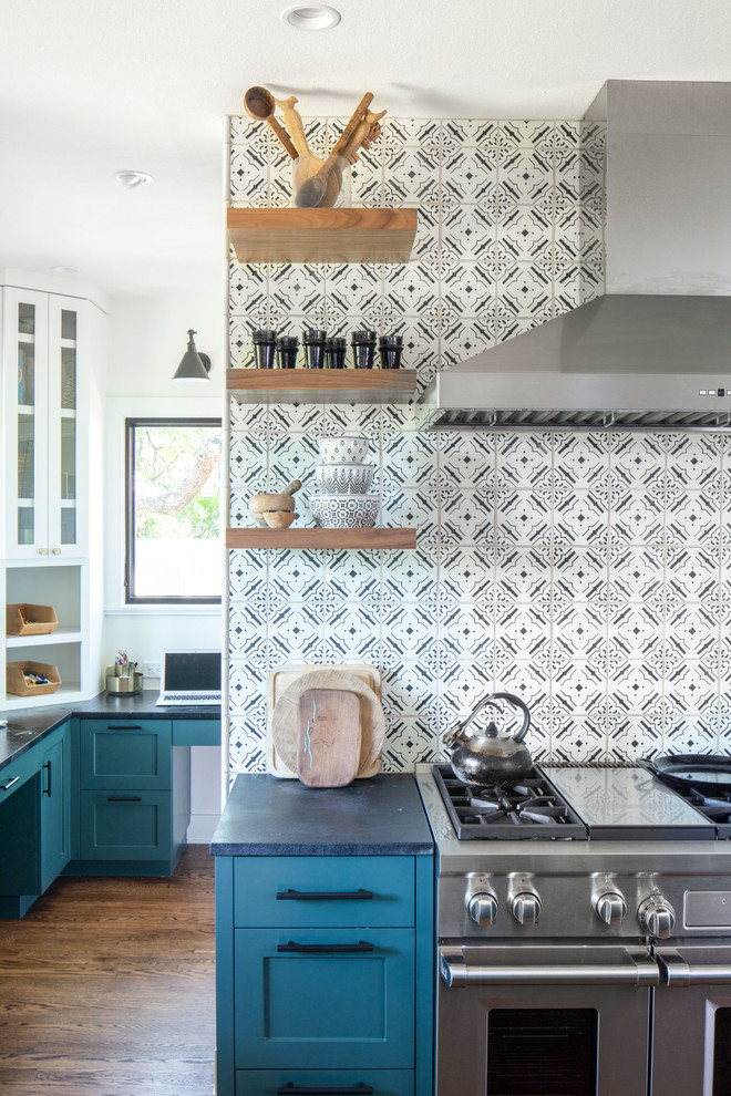 Inspiration for a medium sized traditional kitchen in Austin with glass-front cabinets, turquoise cabinets, soapstone worktops, medium hardwood flooring, brown floors and black worktops.