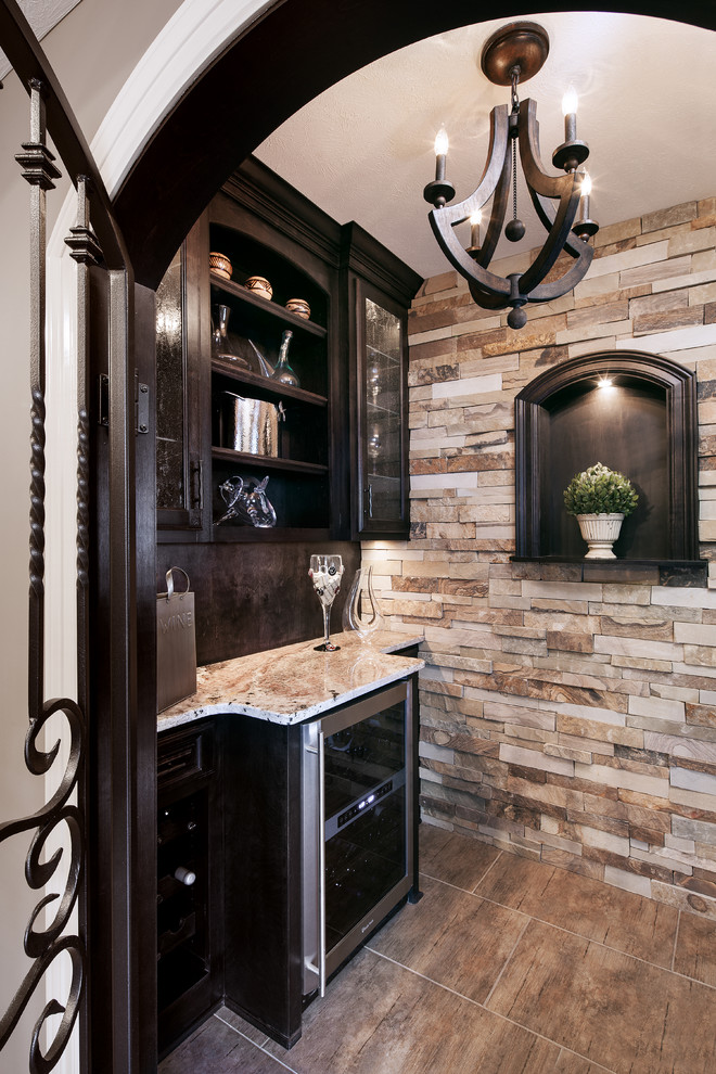 This is an example of a traditional kitchen in Omaha with a feature wall.