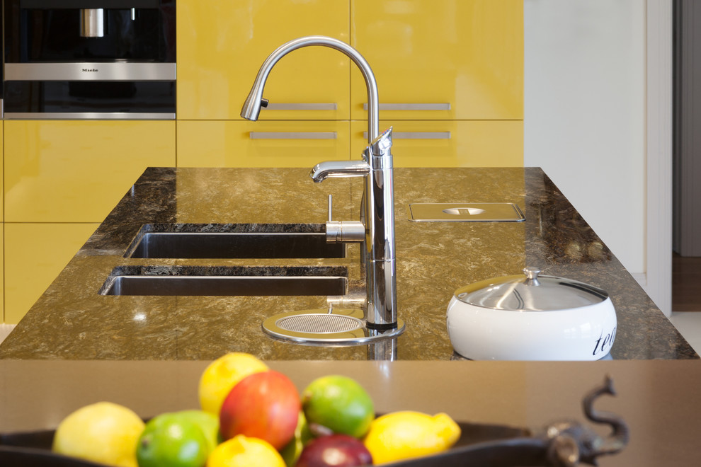 Design ideas for a modern kitchen in Perth with a submerged sink, flat-panel cabinets, yellow cabinets, granite worktops, stainless steel appliances, multicoloured worktops and multiple islands.