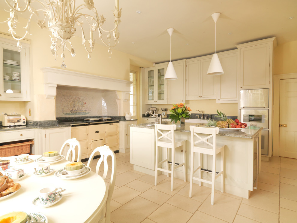 Kitchen - farmhouse kitchen idea in London with stainless steel appliances