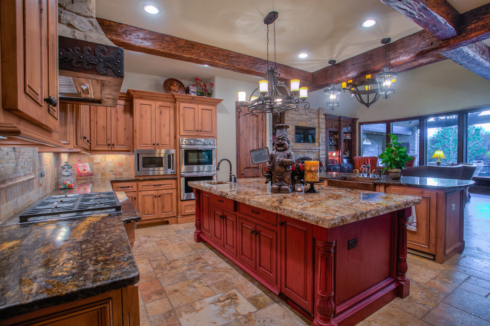 Inspiration for a large rustic u-shaped travertine floor enclosed kitchen remodel in Oklahoma City with raised-panel cabinets, medium tone wood cabinets, beige backsplash, stainless steel appliances, a farmhouse sink, granite countertops, an island and travertine backsplash