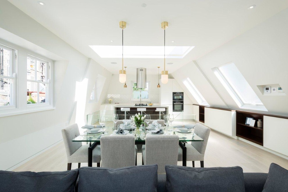 Photo of a contemporary open plan dining room in Other with laminate floors and white floors.