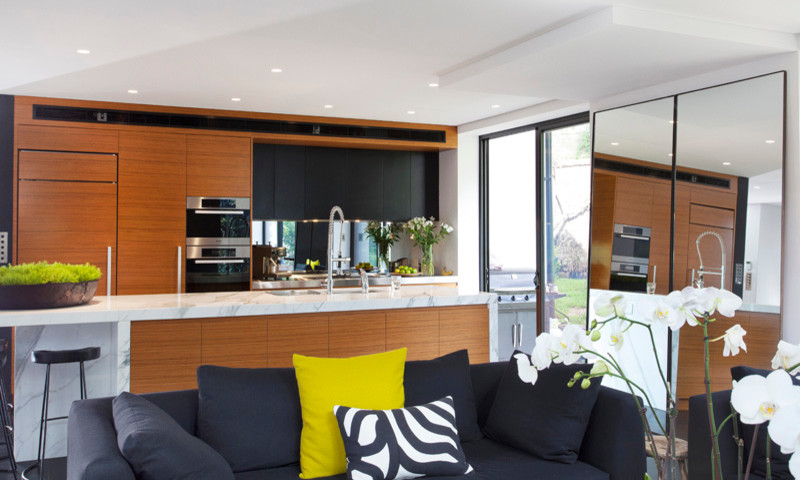 Photo of a small modern u-shaped kitchen/diner in Sydney with a built-in sink, flat-panel cabinets, medium wood cabinets, marble worktops, glass sheet splashback, stainless steel appliances, ceramic flooring and an island.
