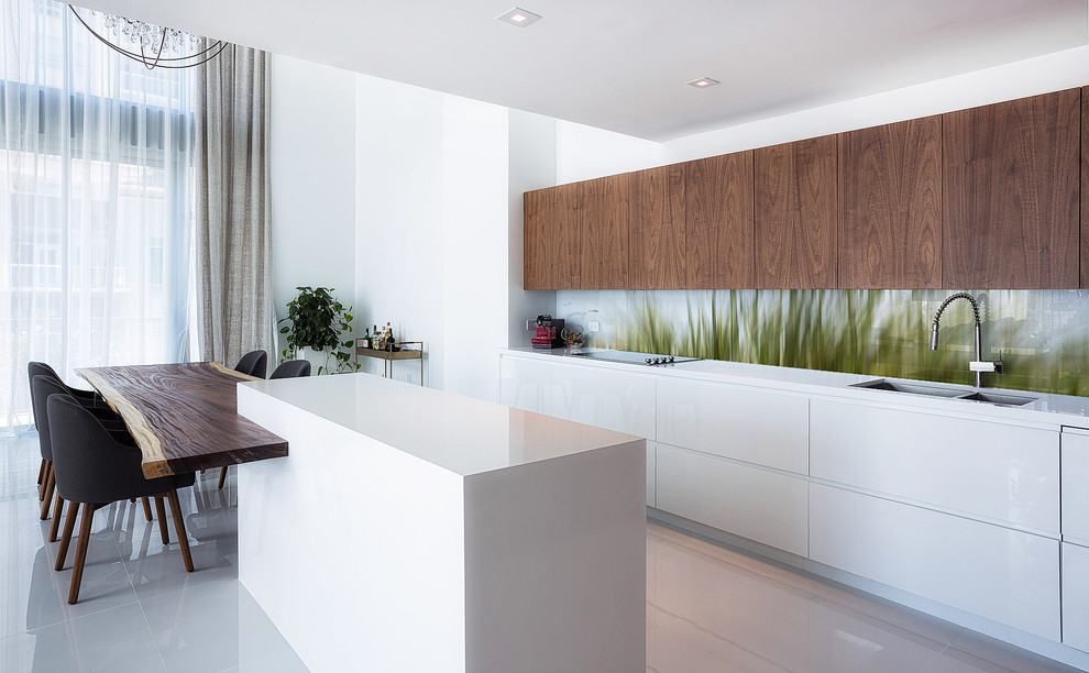 Photo of a medium sized contemporary kitchen in Brisbane with a built-in sink, composite countertops, green splashback, glass sheet splashback, stainless steel appliances, porcelain flooring, an island and white floors.