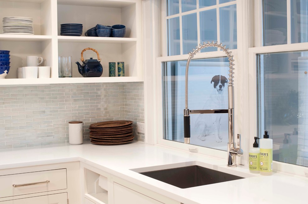 Eat-in kitchen - large coastal u-shaped ceramic tile eat-in kitchen idea in Other with an undermount sink, shaker cabinets, white cabinets, quartz countertops, white backsplash, stainless steel appliances and an island