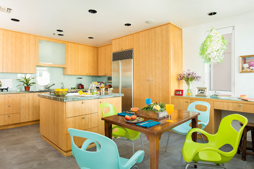Inspiration for a mid-sized coastal u-shaped porcelain tile and gray floor eat-in kitchen remodel in Los Angeles with a double-bowl sink, flat-panel cabinets, light wood cabinets, granite countertops, blue backsplash, glass sheet backsplash, stainless steel appliances and an island
