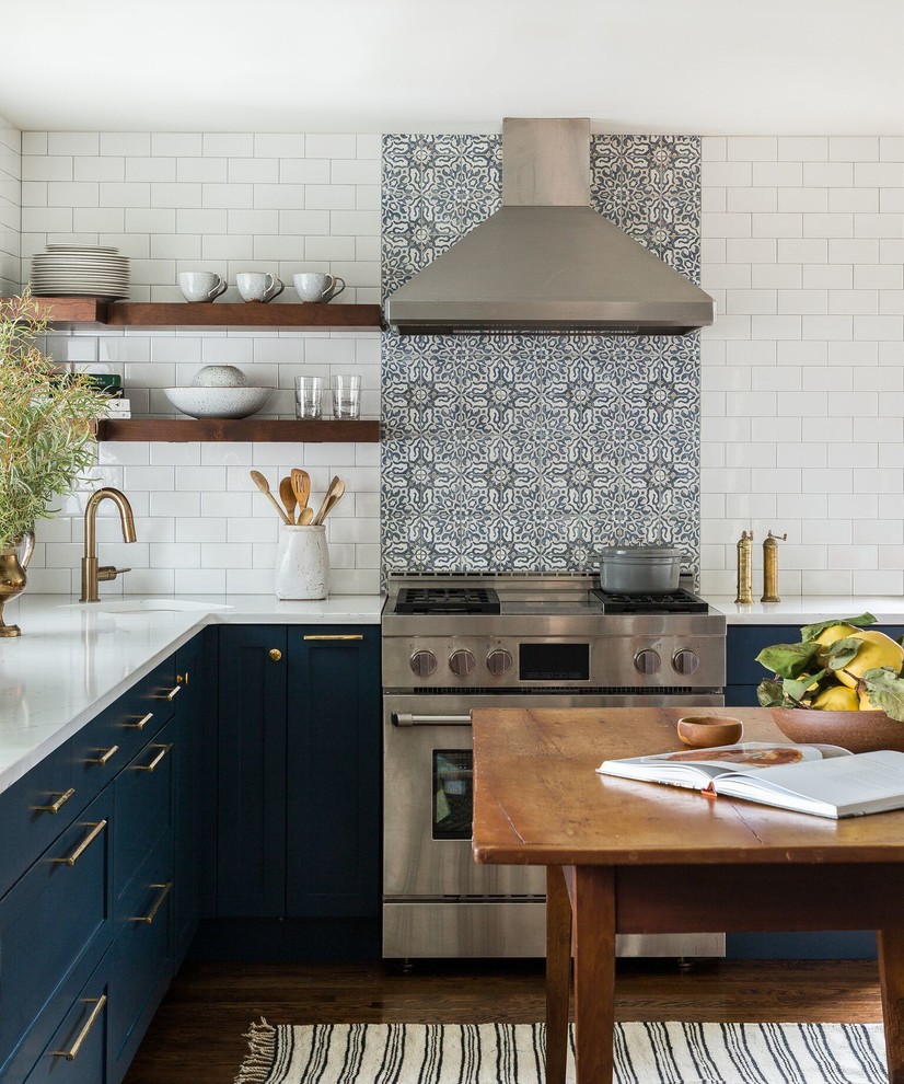 Kitchen - cottage l-shaped dark wood floor kitchen idea in Seattle with an undermount sink, shaker cabinets, blue cabinets, blue backsplash, stainless steel appliances and an island