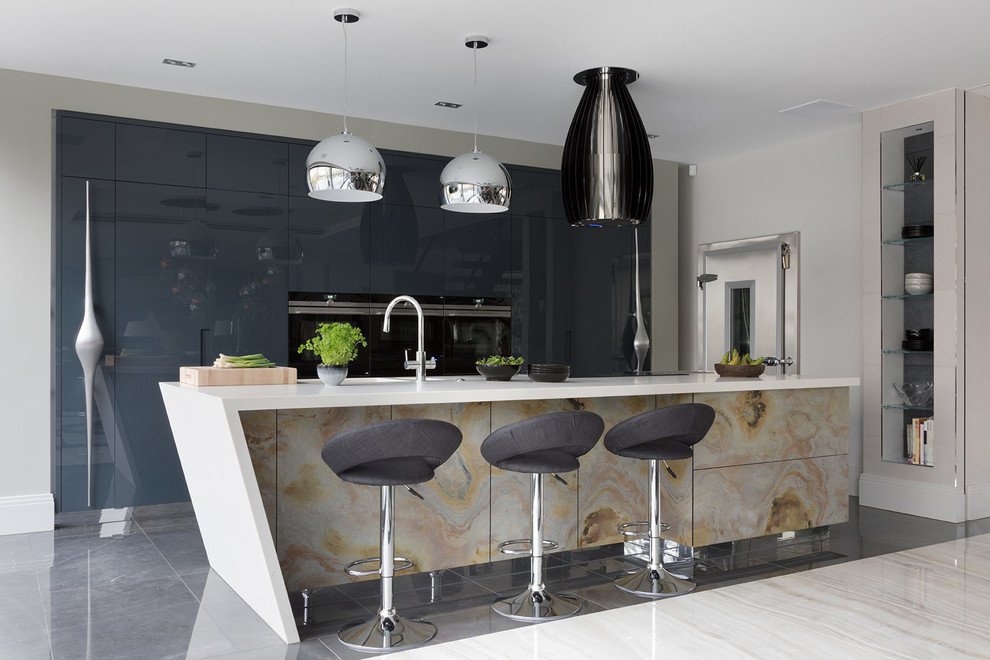 Photo of a large contemporary galley kitchen pantry in Hertfordshire with a submerged sink, flat-panel cabinets, distressed cabinets, quartz worktops, black appliances, porcelain flooring, an island, grey floors and white worktops.
