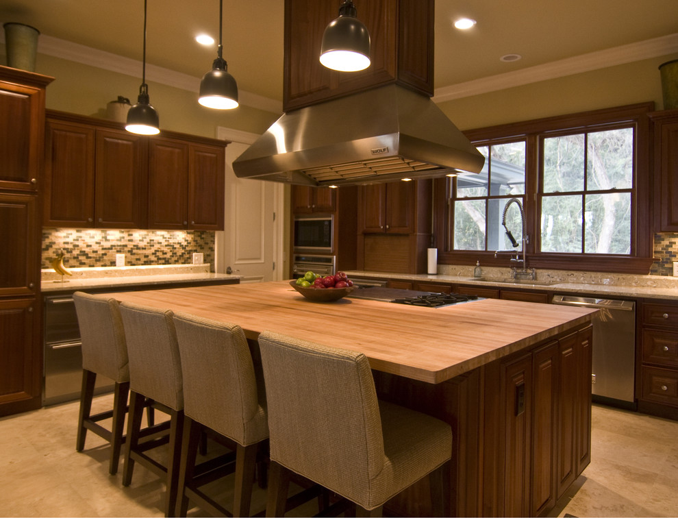 Large trendy l-shaped ceramic tile eat-in kitchen photo in Charleston with a drop-in sink, beaded inset cabinets, medium tone wood cabinets, granite countertops, multicolored backsplash, mosaic tile backsplash, stainless steel appliances and an island
