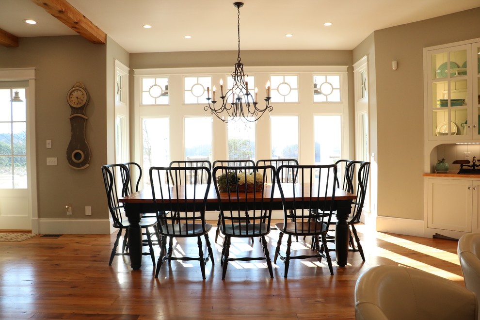 Large country medium tone wood floor open concept kitchen photo in Other with a farmhouse sink, shaker cabinets, white cabinets, granite countertops, gray backsplash, porcelain backsplash, stainless steel appliances, an island and gray countertops