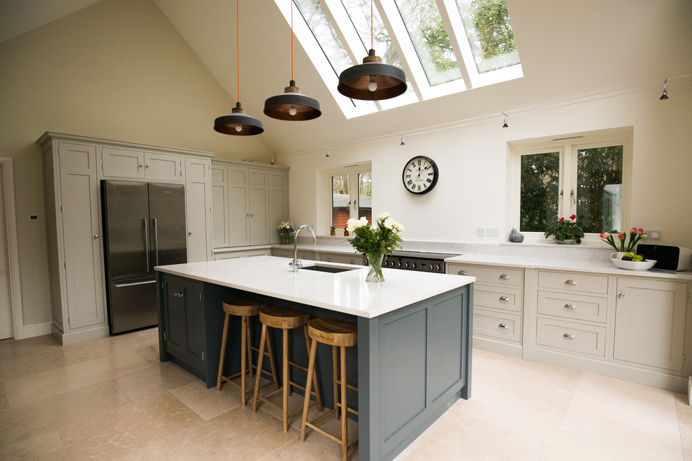 Large cottage eat-in kitchen photo in Surrey with shaker cabinets, quartzite countertops and an island