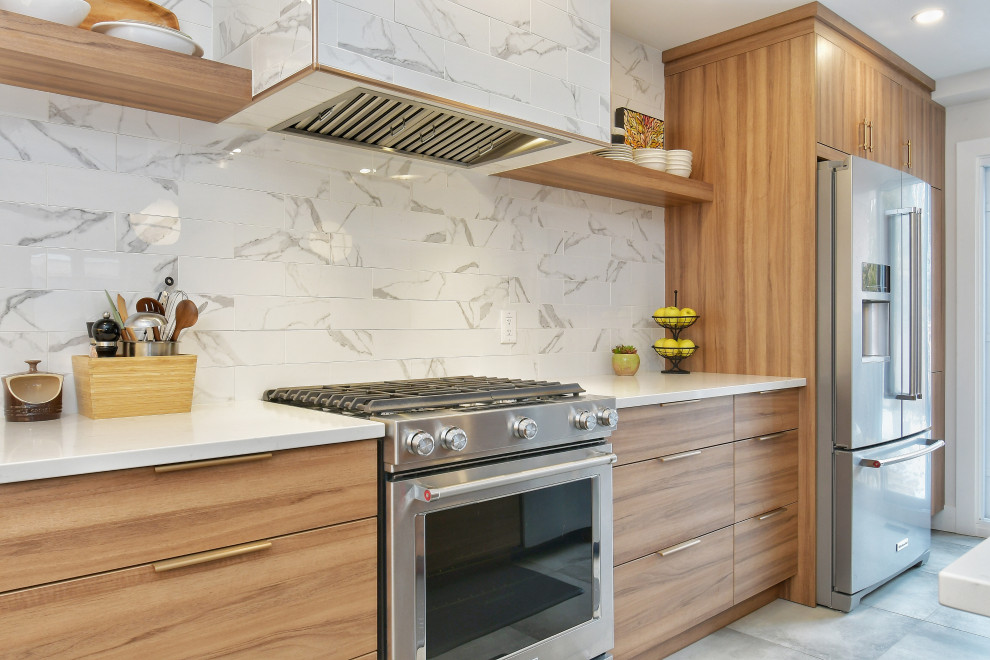 This is an example of a medium sized scandinavian l-shaped kitchen/diner in Toronto with a submerged sink, flat-panel cabinets, medium wood cabinets, engineered stone countertops, multi-coloured splashback, porcelain splashback, stainless steel appliances, porcelain flooring, an island, grey floors and yellow worktops.