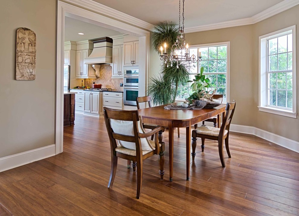 Mid-sized elegant medium tone wood floor and multicolored floor kitchen/dining room combo photo in Jacksonville