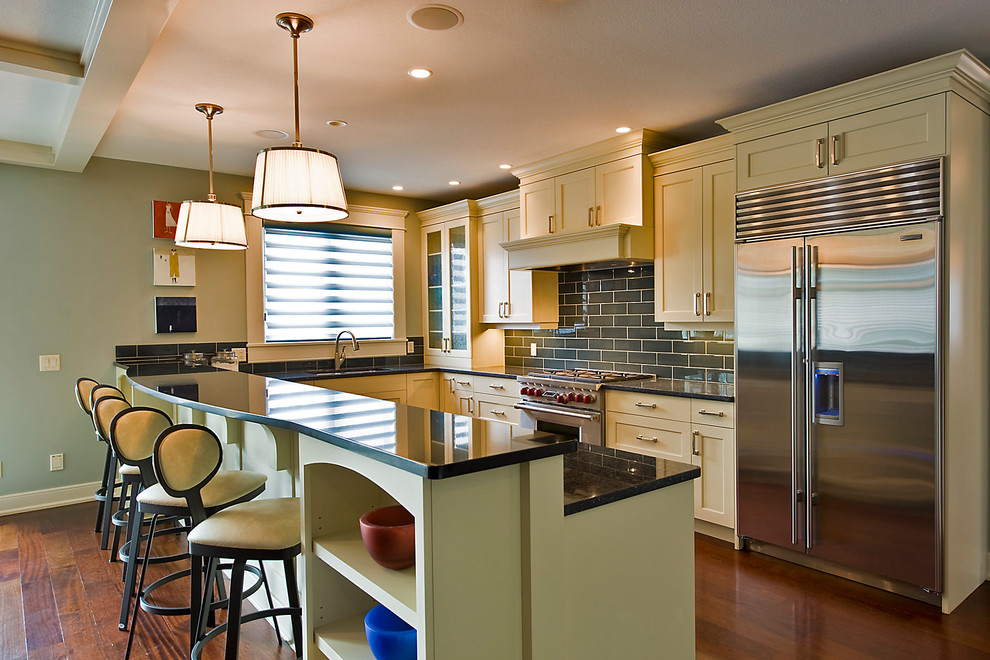 Design ideas for a contemporary kitchen in Vancouver with metro tiled splashback and stainless steel appliances.