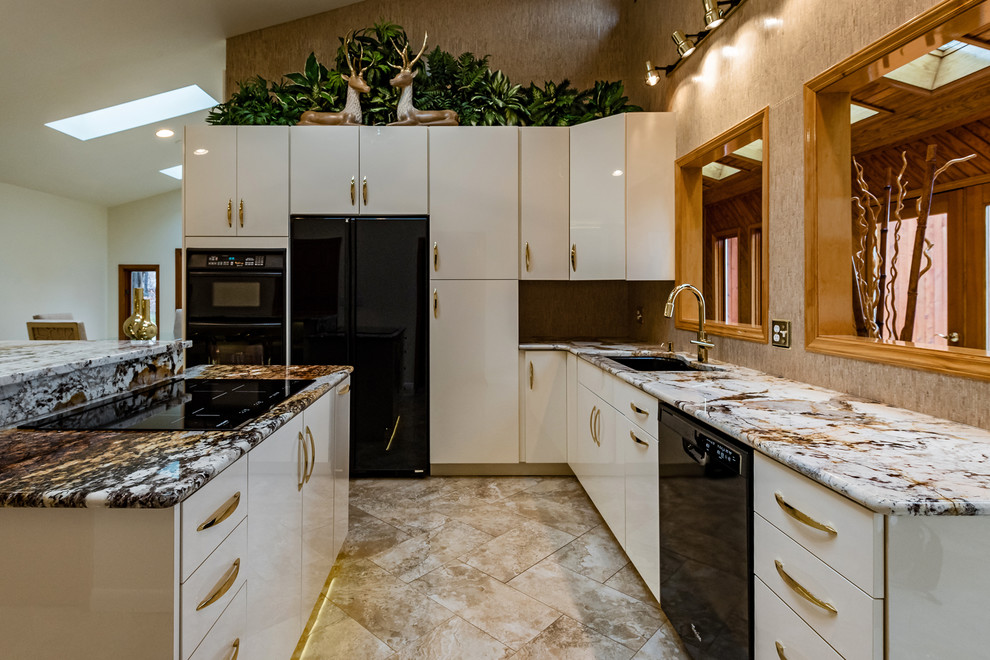 Large contemporary l-shaped kitchen in Other with flat-panel cabinets, white cabinets, granite worktops, black appliances, an island, a submerged sink, beige splashback, beige floors and multicoloured worktops.