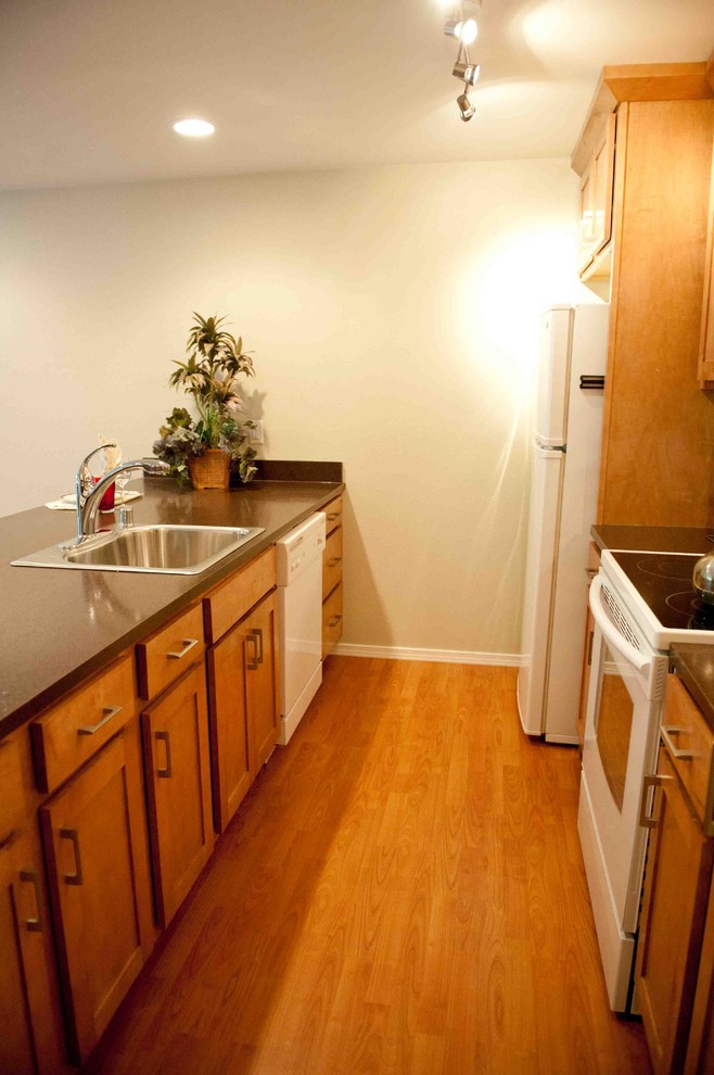 Example of a classic kitchen design in Seattle with white appliances