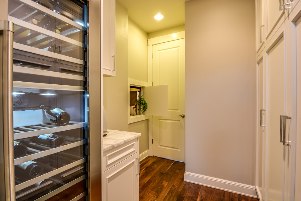 Kitchen pantry - huge modern u-shaped dark wood floor and multicolored floor kitchen pantry idea in Seattle with a double-bowl sink, marble countertops, stainless steel appliances, an island and white countertops