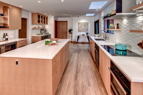 Contemporary kitchen with engineered wood cabinets and large island showcasing protective coatings for engineered wood cabinets to improve durability and style.