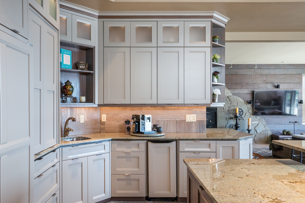This is an example of a classic kitchen in Seattle with shaker cabinets.