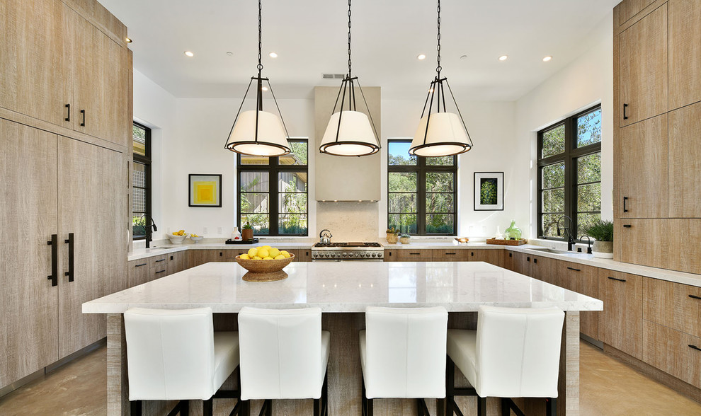 Example of a huge trendy u-shaped light wood floor and beige floor open concept kitchen design in San Francisco with an undermount sink, flat-panel cabinets, light wood cabinets, quartz countertops, paneled appliances and an island