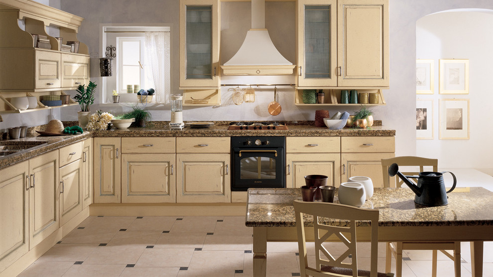 Foto di una cucina chic di medie dimensioni con lavello a doppia vasca, ante con bugna sagomata, ante beige, top in granito, elettrodomestici neri, pavimento con piastrelle in ceramica e 2 o più isole