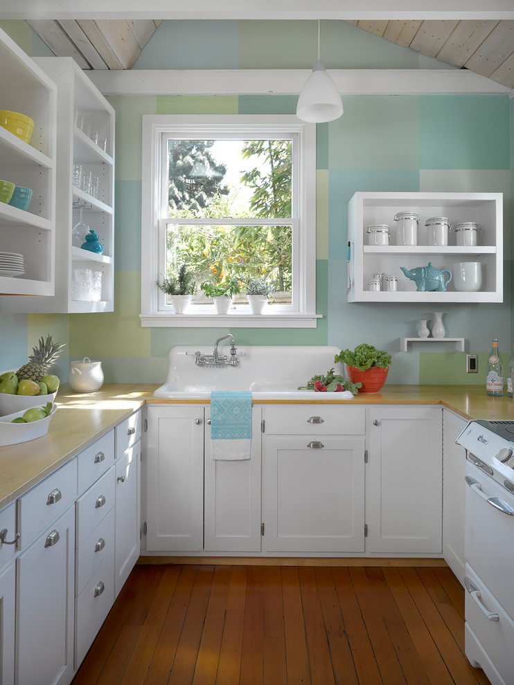 Eclectic u-shaped medium tone wood floor and orange floor kitchen photo in San Francisco with a drop-in sink, open cabinets, white cabinets, window backsplash and white appliances