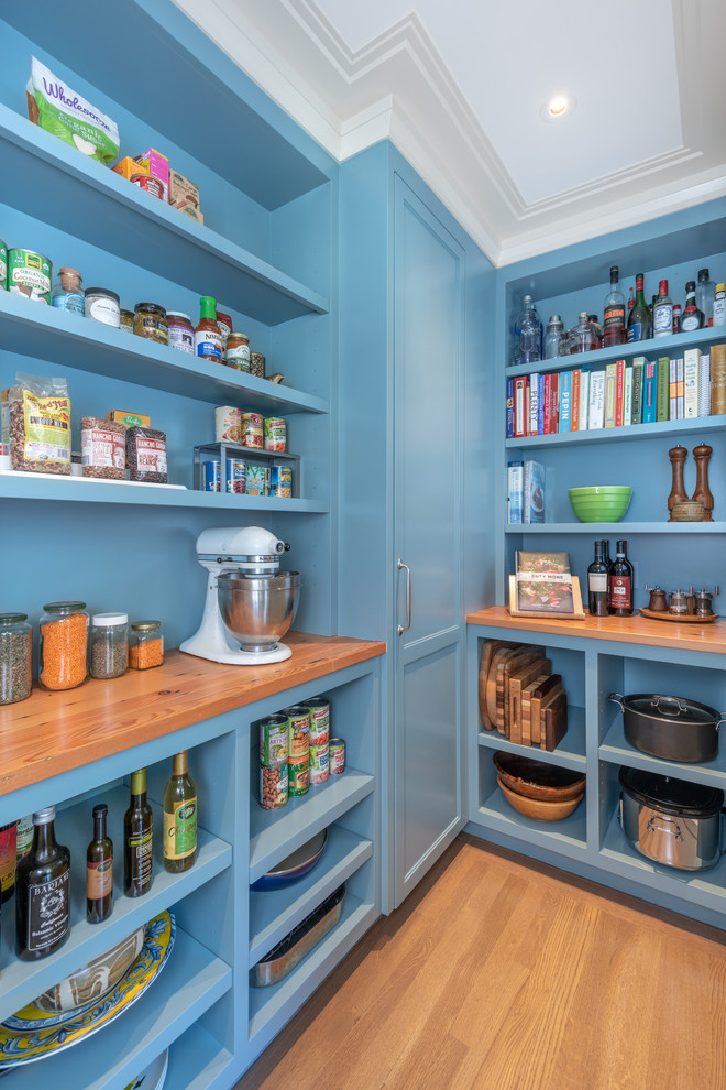 This is an example of a classic kitchen pantry in San Francisco with blue cabinets, open cabinets, wood worktops, medium hardwood flooring, brown floors and brown worktops.