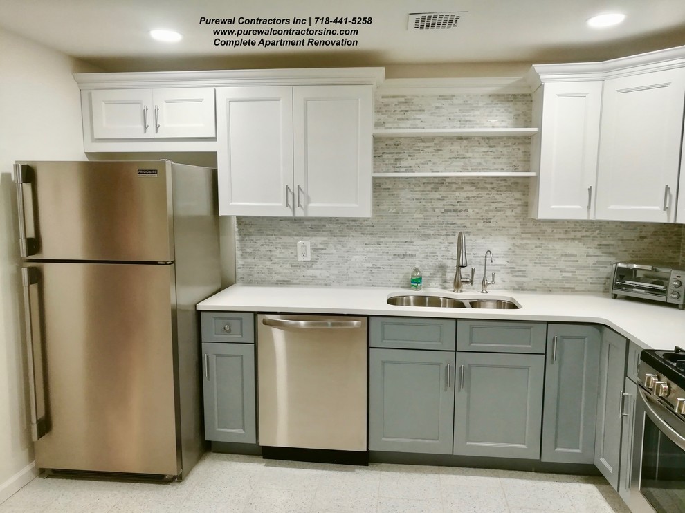Large transitional l-shaped porcelain tile and white floor eat-in kitchen photo in New York with a double-bowl sink, shaker cabinets, white cabinets, quartz countertops, gray backsplash, glass sheet backsplash, stainless steel appliances, no island and white countertops