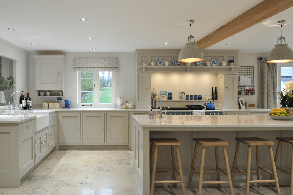 Design ideas for an expansive classic l-shaped open plan kitchen in Other with a belfast sink, shaker cabinets, grey cabinets, quartz worktops, coloured appliances, limestone flooring and an island.