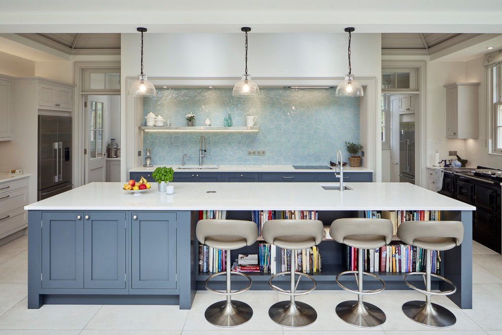 Eat-in kitchen - mid-sized transitional u-shaped gray floor eat-in kitchen idea in Berkshire with shaker cabinets, blue cabinets, blue backsplash, an island, an undermount sink and stainless steel appliances