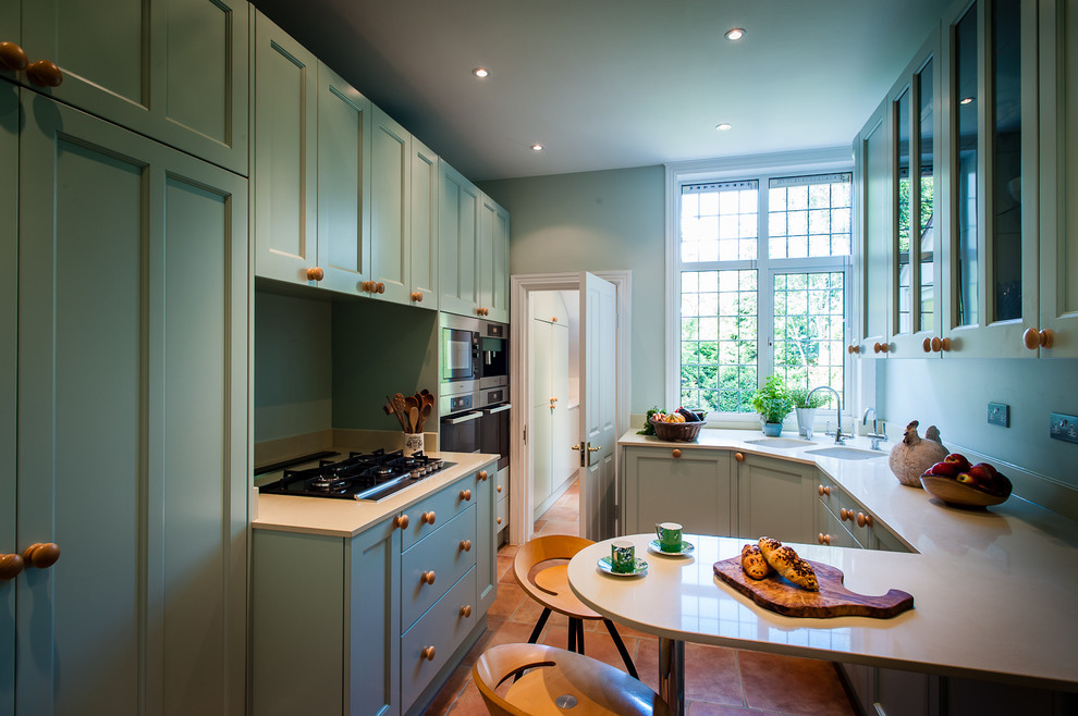 This is an example of a small traditional kitchen in Kent.