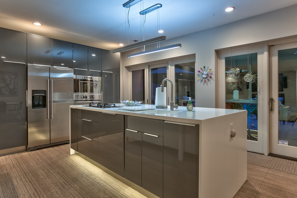 Inspiration for a contemporary kitchen remodel in Omaha with an integrated sink, flat-panel cabinets, gray cabinets, stainless steel appliances and an island